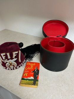 Vintage Shriners Potentate fez hat with custom case and book.