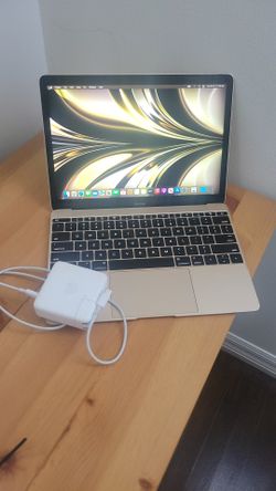 Apple MacBook 12 inch 2016 Gold 8 GB ram 500 GB hardrive with charger  has a couple small dents barely even noticeable everything works screen and key