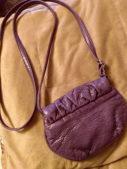 Small cross body purple purse.