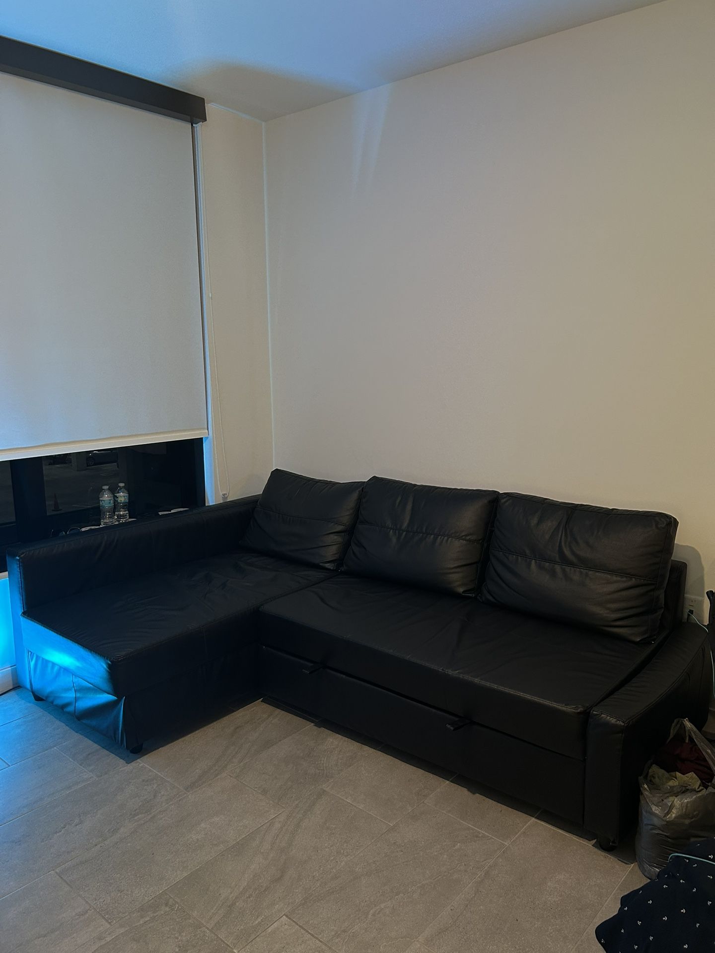Couch: FRIHETEN Sleeper sectional, 3 seat w/storage, Bomstad black (Gently used)