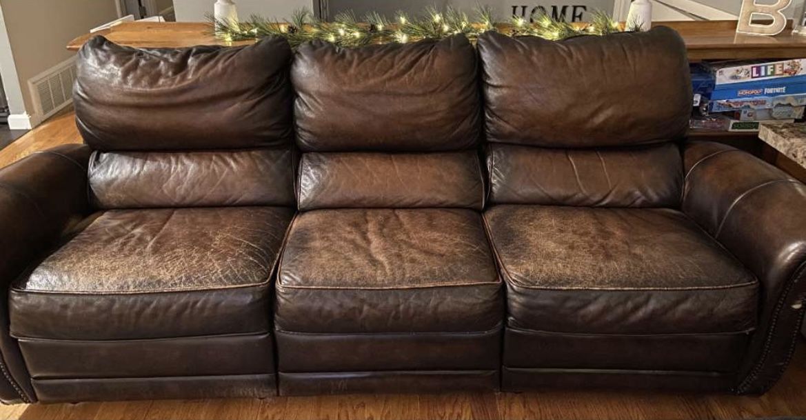 Brown Leather reclining Sofa with Brown leather recliners and a Coffee Table