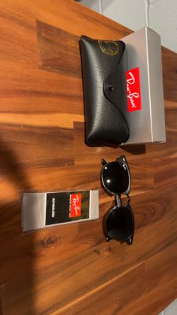 Black on black ray ban glasss