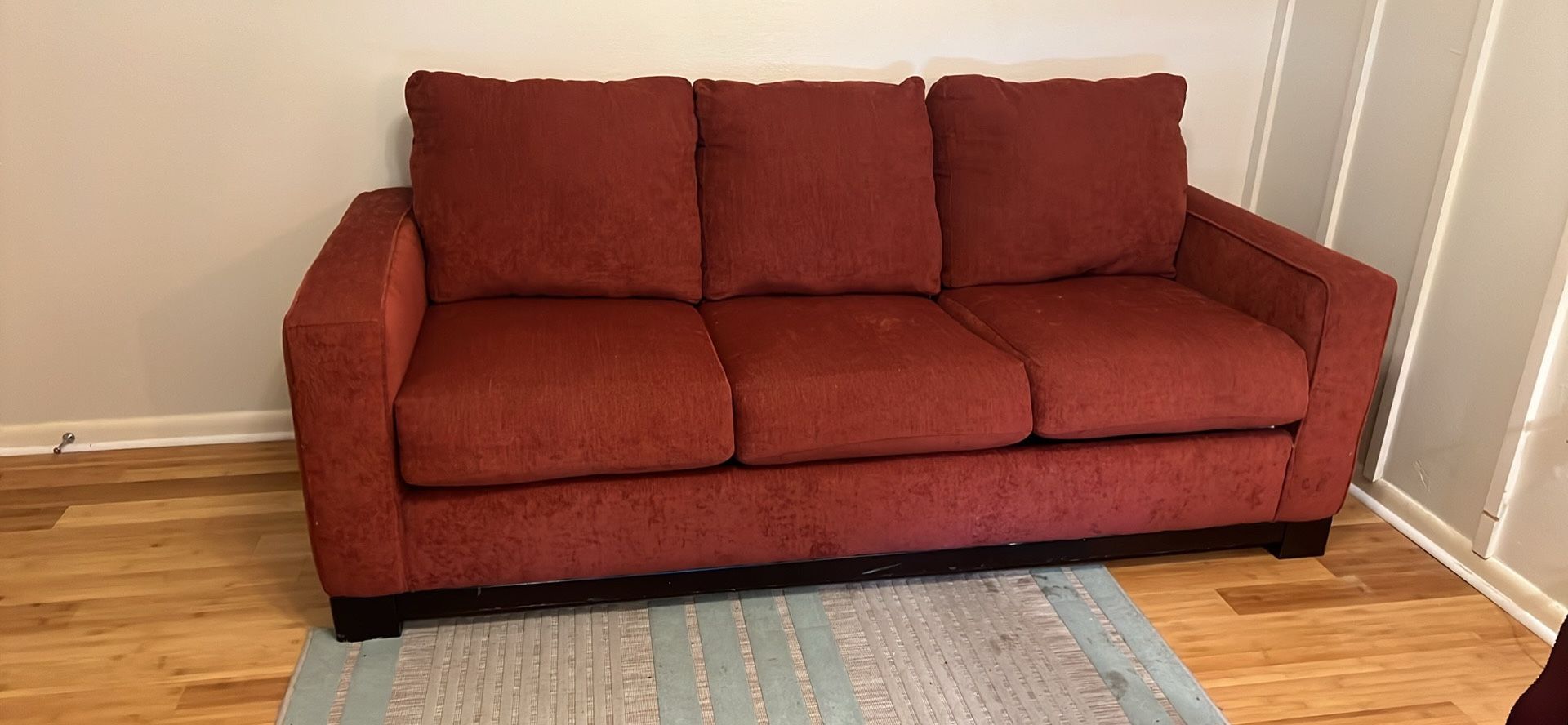 Red cloth pull out couch / futon