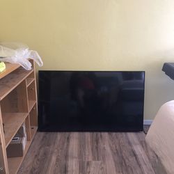 Insignia 48 inch LCD TV with a remote