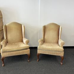 two gold statement chairs 