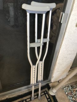 Adjustable metal crutches