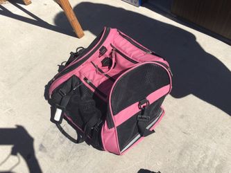 Pink pet carrier for a small or medium sized animal
