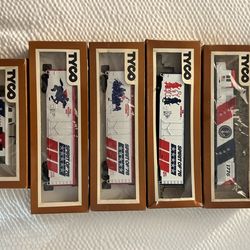 Model train sets + bin of track , accessories, power supplies, parts and vintage catalogs.