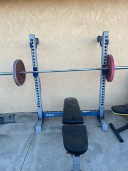Bench, bar, weights, workout machine
