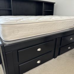 Black Wood Twin Bed Storage Below Plush Clean Mattress
