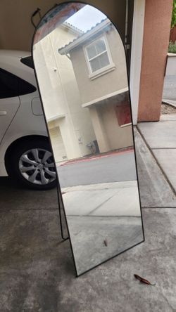 Standing arched full length mirror