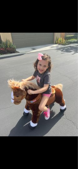 Pony cycle ride on horse