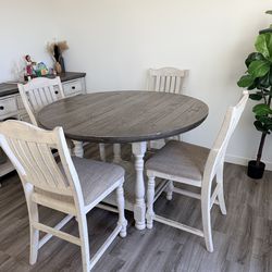 Round dining table with 8 chairs