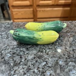 Ceramic Vintage Japan Pickles Pair of  salt and pepper shakers.  Preowned.  Has been on display in a cabinet with a salt and pepper shakers collection