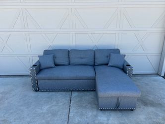 Small Grey Sectional with Rollout Ottoman and Storage Chaise