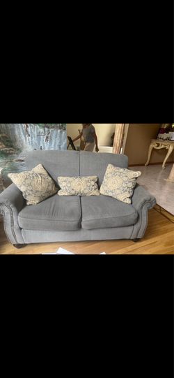 Two gray loveseats