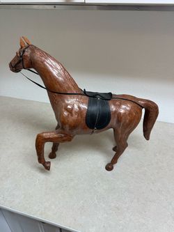 Vintage mid-century leather-wrapped decorative horse figurine with saddle and tack.