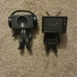 Two Skibidi Toilet Figurines