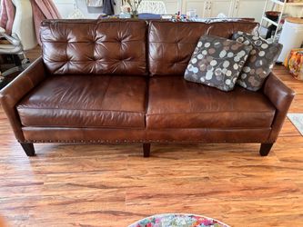 MOVING SALE - Like New Brown Leather couch with decorative pillows