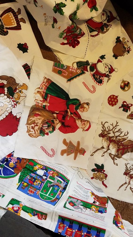 Vintage christmas fabric panels. 8 peices total. One is a fabric book.