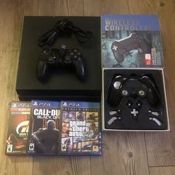 PS4 w/2 Controllers & 3 Games