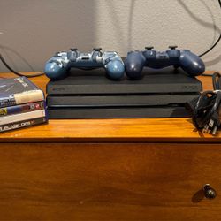 PS4 Pro W/ 2 Controllers , And 4 GamesGames 