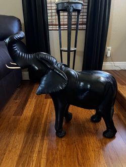 Beautifully hand-carved dark solid wood elephant sculpture