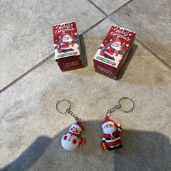 2 Merry Christmas doll pendant. Open box