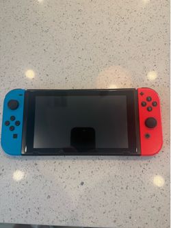 Nintendo Switch + 64 GB Micro SD card installed.