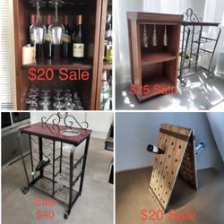 mahogany wrought iron bar cart $40,  2 layer wood bar cabinet w/glass hold $25,  French rustic A-Frame Standing Wine Rack 48 bottles $20.