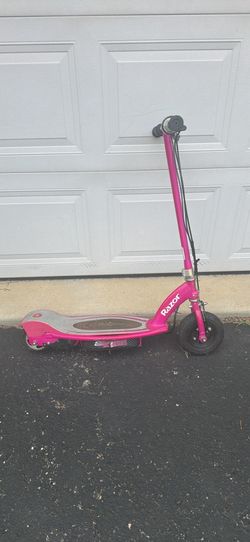 pink Razor E100 Electric Scooter. Has scratches/rust from use see pics. Has brand new batteries & comes w charger