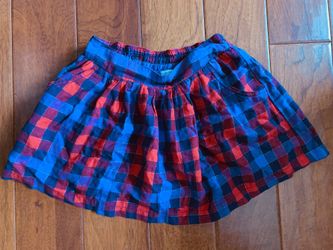 Super cute like new Justice size 12 skirt with built-in shorts red and blue has elastic waist band inside pockets. Smoke-free home