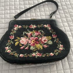 Leather lined needle point purse