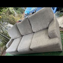 Brownish town couch and loveseat set great condition clean we sell all the time delivery extra