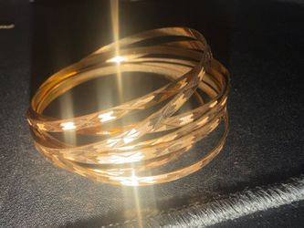 Stunning Set of 7 Diamond-Cut Gold Bangles (33.7g Total)