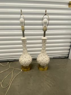 White ceramic lamps with floral overlay