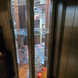  Solid Wood. vintage wooden corner curio cabinet with a mirrored back and glass shelves.  And Lights  