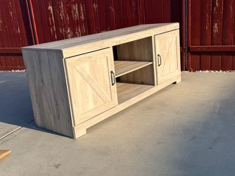 Ashely’s furniture  Bellaby 63" TV Stand like new