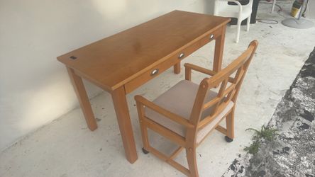 A desk with a chair