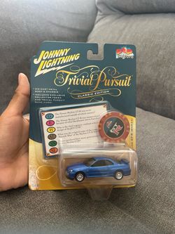 Johnny Lightning Pop Culture Trivial Pursuit Classic Edition Nissan Skyline GT-R R34