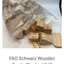 assorted natural wooden building blocks. These are typically children's toys designed for imaginative play and skill development. 