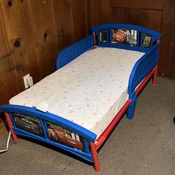 Disney Delta Children Disney/Pixar Cars Plastic Toddler Bed, with Mattress