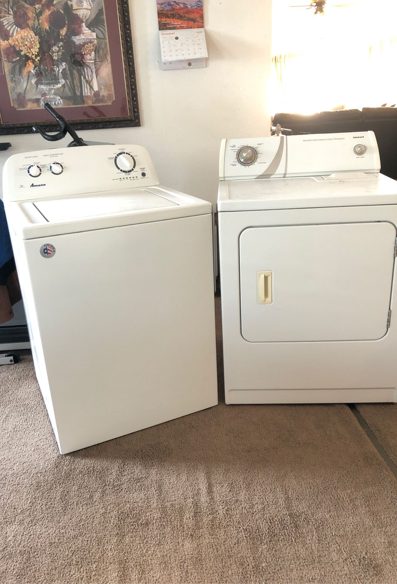 Washing machine is Amana and it’s 2 years old. Dryer is Admiral, both of them work great, I graduated and bought another set with pedestals