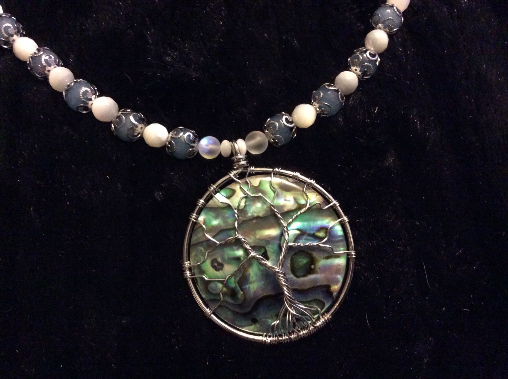Tree of life abalone pendant on aquamarine, moonstones, Mother of pearl and labradorite beads with a sterling silver chain and adjustable clasp