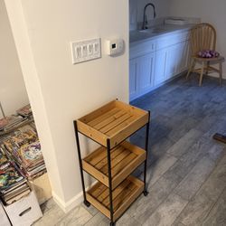 3-Tier Rolling Storage Cart – Wood & Metal (Woodland Hills)  Description: Selling a stylish 3-tier storage cart in great condition.  * Wood shelves wi