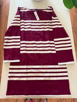 This is a J.Crew Long-sleeve Mini Dress in Striped Mariner Cloth, featuring a Crushed Crimson and white horizontal stripe pattern.  * The dress is cra