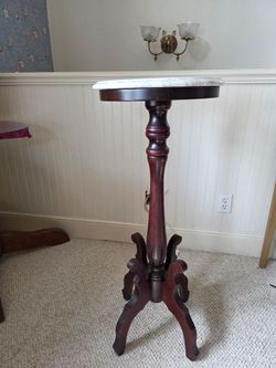 Mahogany asked marble pedestal table