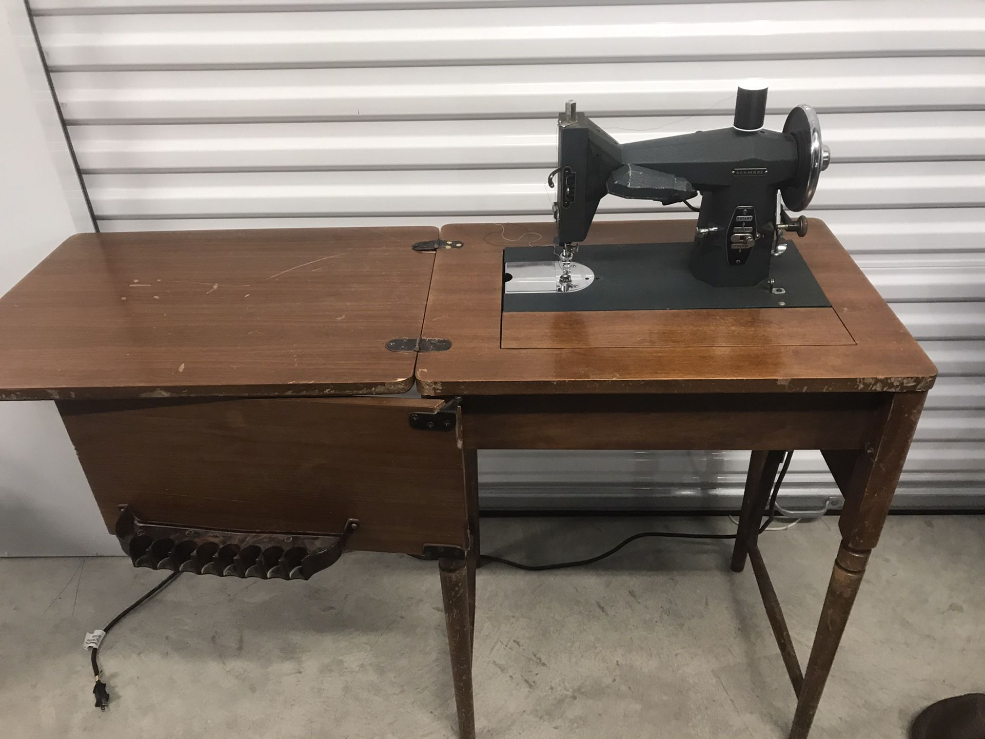 Antique Kenmore sewing machine with cabinet