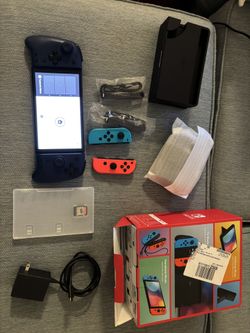 Nintendo Switch Oled in excellent condition with one game (Monster hunter), grip $ and screen protector