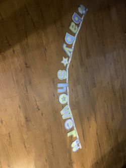 Baby shower banner & Tummy measuring tape for a game